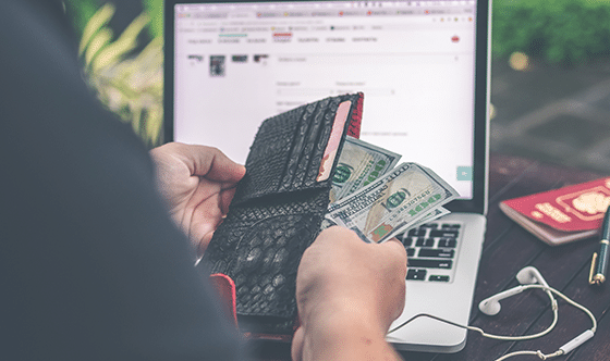 Person pulling money out of wallet