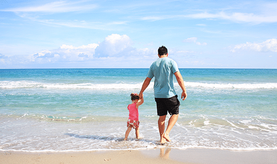 Father and daughter at the beach