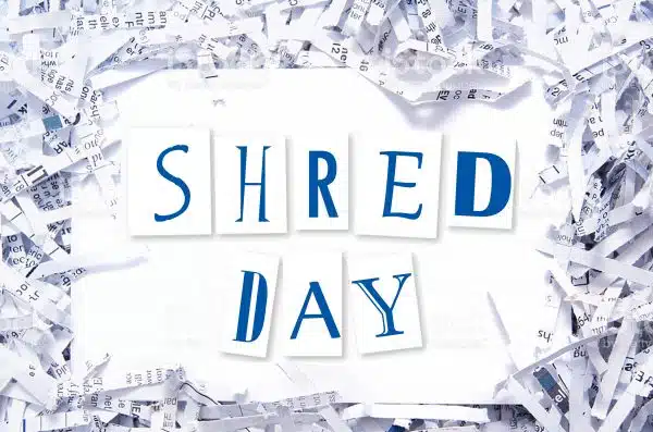 Shred Day text surrounded by paper shreds