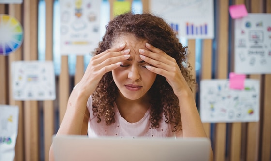 Frustrated woman in front of computer screen