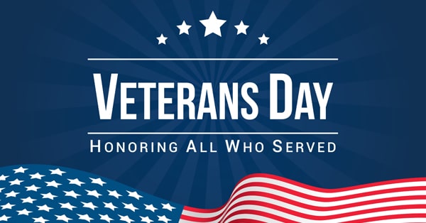 Veterans Day - Honoring All Who Served with wavy american flag below and 5 stars arched above