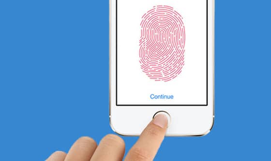 Person using fingertouch id on iphone