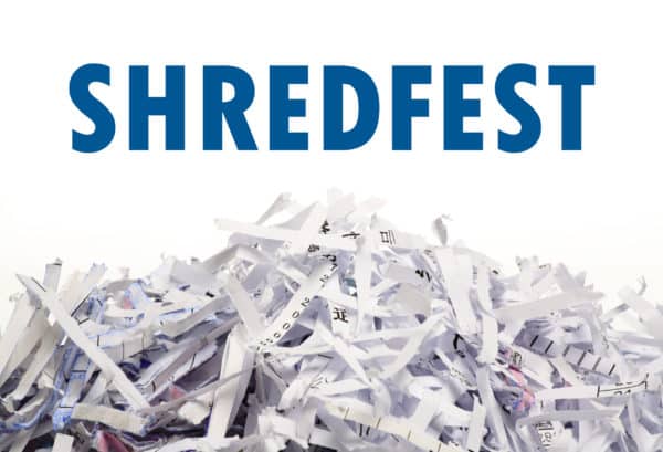 pile of shredded papers with the word Shredfest above in blue