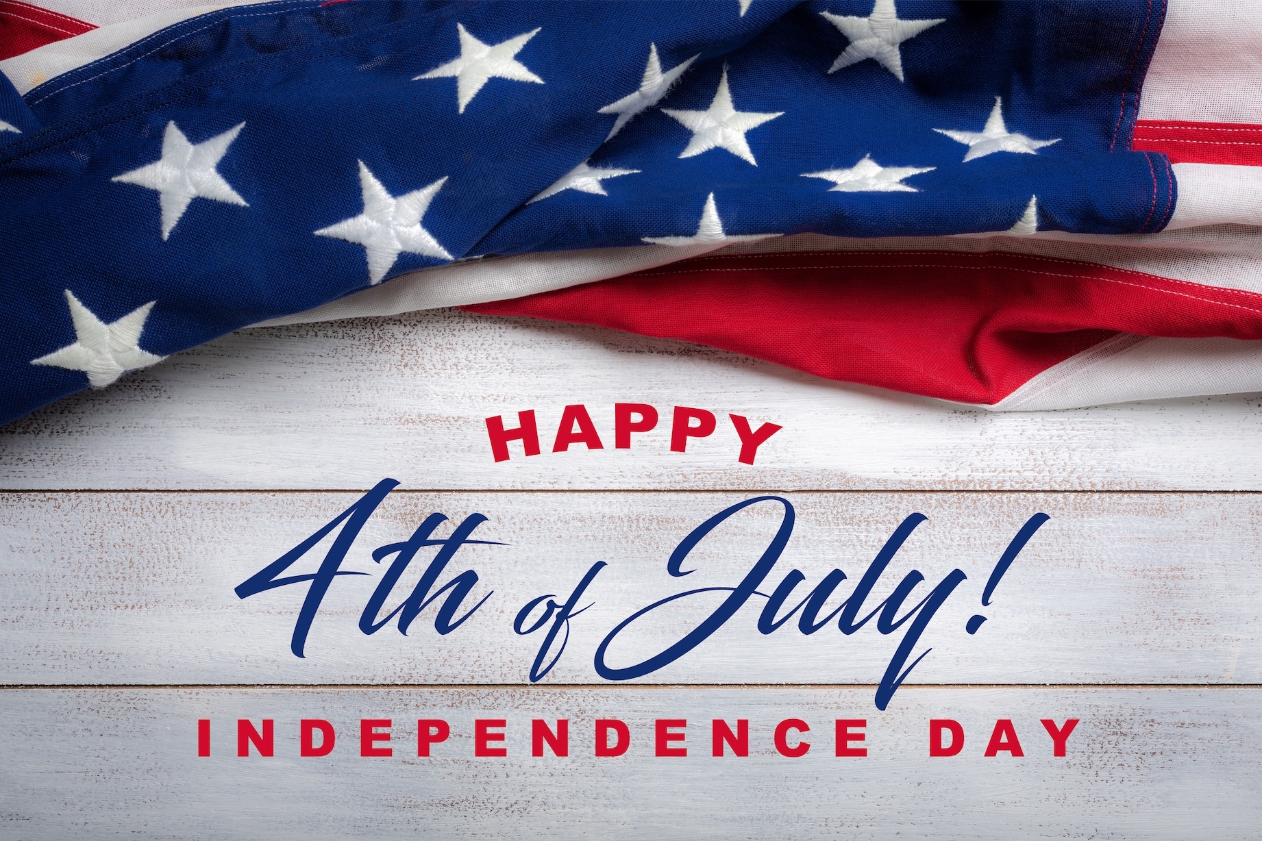 Shiplap background with American flag laying across. Includes text "Happy 4th of July Independence Day"