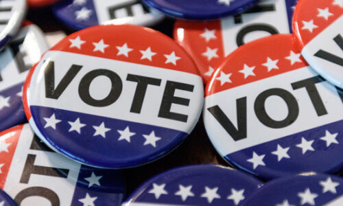 pile of vote buttons red white and blue
